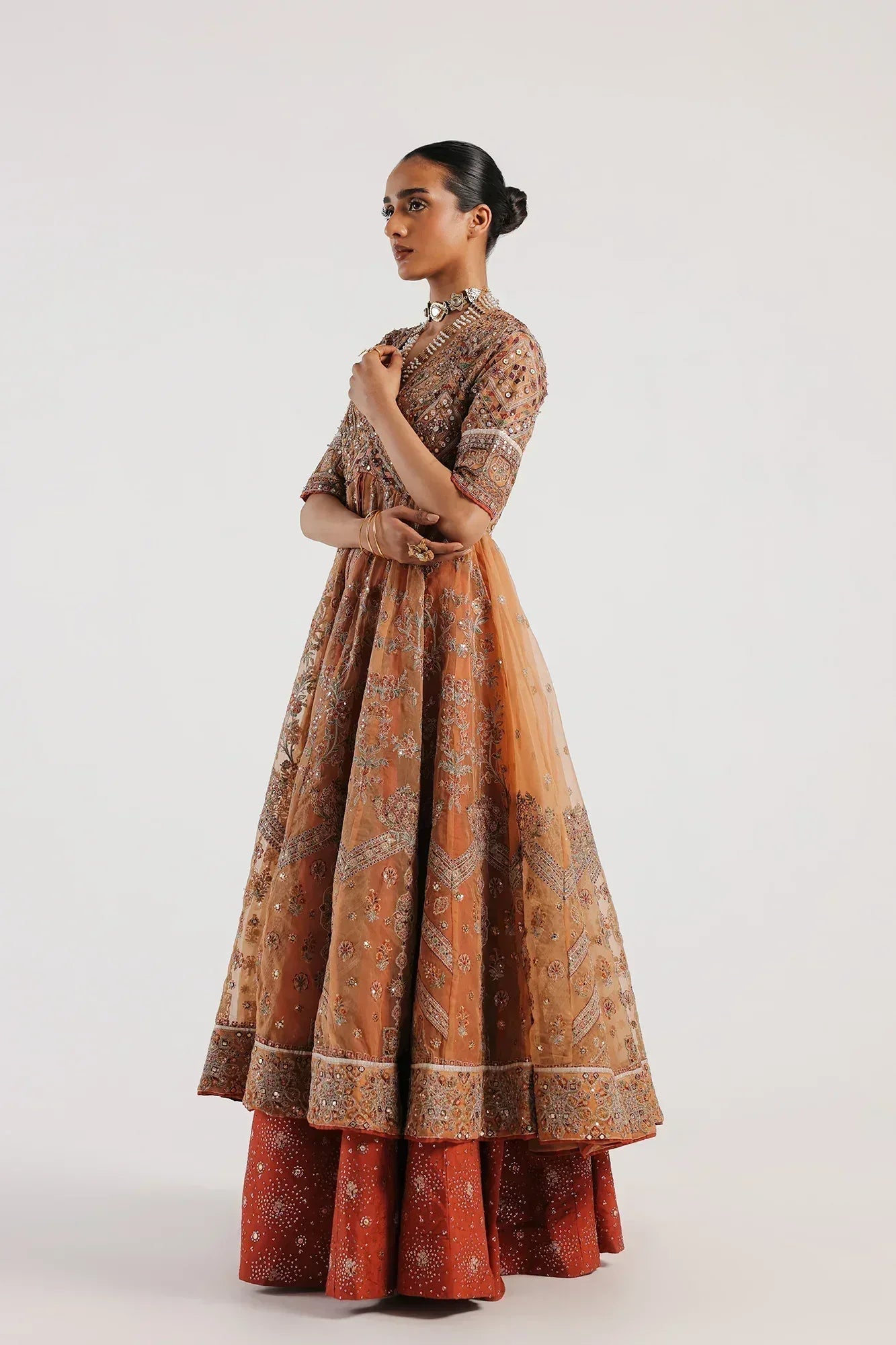designer ethnic dresses Eetra By Himanshi | Designer fashion label | Enchanting details for an enchanting evening. She looks like a dream in the Red sharara dress, proving that the right silhouette is the